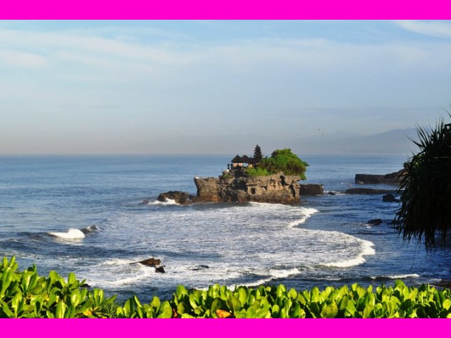The Tanah Lot Temple at high tide when it becomes an island.